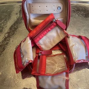 Sundance Soft and Collapsible Leather Jewelry Case with a J in a deep red.